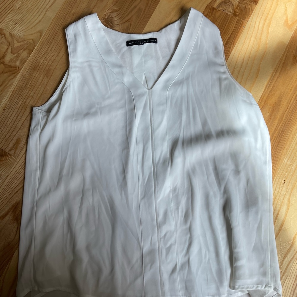 White sleeveless blouse